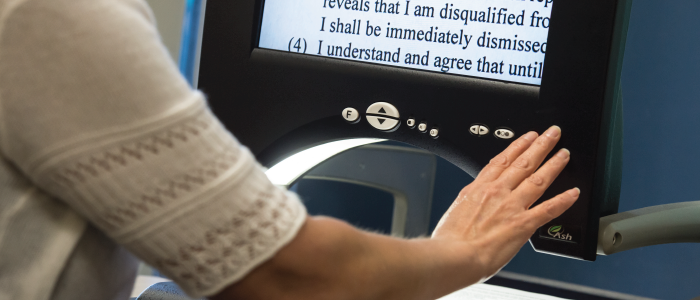 person using text magnifier