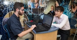 students working at laptops